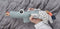 Done by Deer - Tiny sensory rattle, Croco