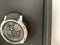 Garmin Instinct 2 Solar Surf editie Bells Beach 45 mm zilver met een zwart siliconen polsband