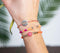 Scmyk BG-267 B - Kralenarmband - Verstelbaar 16-18 cm - Zilverkleurig met oranje koord