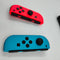 Nintendo Switch OLED - Handheld - 7 inch OLED-scherm 64GB - Blauw Rood