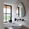 Atmooz - Wandspiegel Stone Large - Driehoekig / Rond - Industrieel - Zwart - Metaal - 48cm hoog en 60cm breed