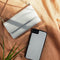 Selencia Hoesje Geschikt voor iPhone 11 Hoesje Met Pasjeshouder - Selencia Eny Uitneembare Vegan Lederen Clutch - Grijs