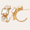 Creolen met 3 beige en gouden kristallen