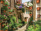 Customize-it - Bloemen straat 70x50cm Tuinschilderij