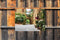 Customize-it - Pleintje 70x50cm Tuinschilderij