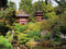 Customize-it - Theehuis 70x50cm Tuinschilderij