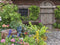 Customize-it - Tuinschuur 70x50cm Tuinschilderij