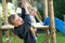 Houten Speeltoestel Niels (SwingKing) | Speeltoren met Glijbaan en Dubbele Schommel voor Buiten in de Tuin | FSC Hout - Glijbaan Geel