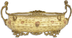 EEN OP MESSING GEMONTEERDE PORSELEINEN PLANTENBAK