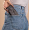 iMoshion Hoesje Geschikt voor iPhone 12 Pro / 12 Hoesje Met Pasjeshouder - iMoshion Design Softcase Bookcase - Wit / Zwart / Woman Flower Black