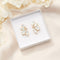 Oorbellen met witte kristallen: the white Crystal leaves