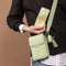 Telefoontasje Dames Crossbody - Selencia Avani Slang Telefoontasje Crossbody - Universeel Schoudertasje telefoon - Groen