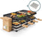 Princess 162955 Raclette en Steengrill Pure 8 Bamboe - Regelbare thermostaat - 1300W - 2 grillplaten en extra Steengrill - 8 pannetjes - 2 meter snoer - Parking deck voor ongebruikte pannetjes