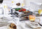 Rommelsbacher Raclettegrill RCC 1500 Mode – Gourmetset voor 8 personen – luxe raclette met omkeerbare grillplaat – antiaanbaklaag – inclusief pannetjes en spatels – 1500W – XXL snoer