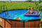 EXIT Wood zwembad ø427x122cm met filterpomp - bruin