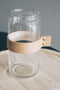 TAK Design Vaas Wrap Me - Incl. Lederen Band - Glas - Ø10 x 30 cm - Bruin