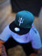 Capiche® Snapback Pet Heren – Typhon – Groenblauw & Zwart – Verstelbaar met Druksluiting – Sportcap – Baseball Cap – Mannen Cap – Griekse Mythologie