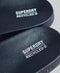Superdry Code Core Vegan Pool Slide - Badslippers - Iconisch logo - Donkerblauw/Wit - Maat 42/43