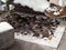 Beliani OKCULU - Patchwork rug - Brown - 160 x 230 cm - Cowhide leather