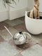 Stylish metal watering can for indoor use.