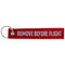 Pendant with the lettering Remove before flight Mini, dimensions approx. 10.9 x 2.2 cm