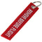 Pendant with the lettering Remove before flight Mini, dimensions approx. 10.9 x 2.2 cm