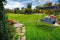 Tuinschommelbank - gevlochten armleuningen - 180x139x185cm - antraciet