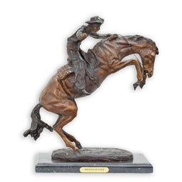 BRONZEN BEELD MET DE NAAM “BRONCO BUSTER”