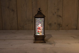 Anna's Collection - LANTAARN KERSTMAN IN GLITTER WATER LED WARM WIT 13,5X20CM 3XAA EN DC AANSLUITING