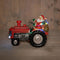 Anna's Collection - Tractor met kerstman, rook, geluid en licht op batterij 23x17 cm