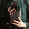 Selencia Hoesje Geschikt voor iPhone Xs / X Hoesje Met Pasjeshouder - Selencia Tierra Uitneembare Slang Clutch - Zwart