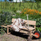 Weltevree | Wheelbench | Kruiwagenbank Eikenhout | 2 tot 3 Persoons Tuinbank | Buiten Bank Verrijdbaar | Combinatie Bank en Kruiwagenwiel