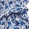 Wikkeljurk met blauwe bloemenprint