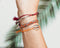 Scmyk BG-263 - Goudkleurige armband met verstelbare lengte en flosjes - Donkerroze sluiting